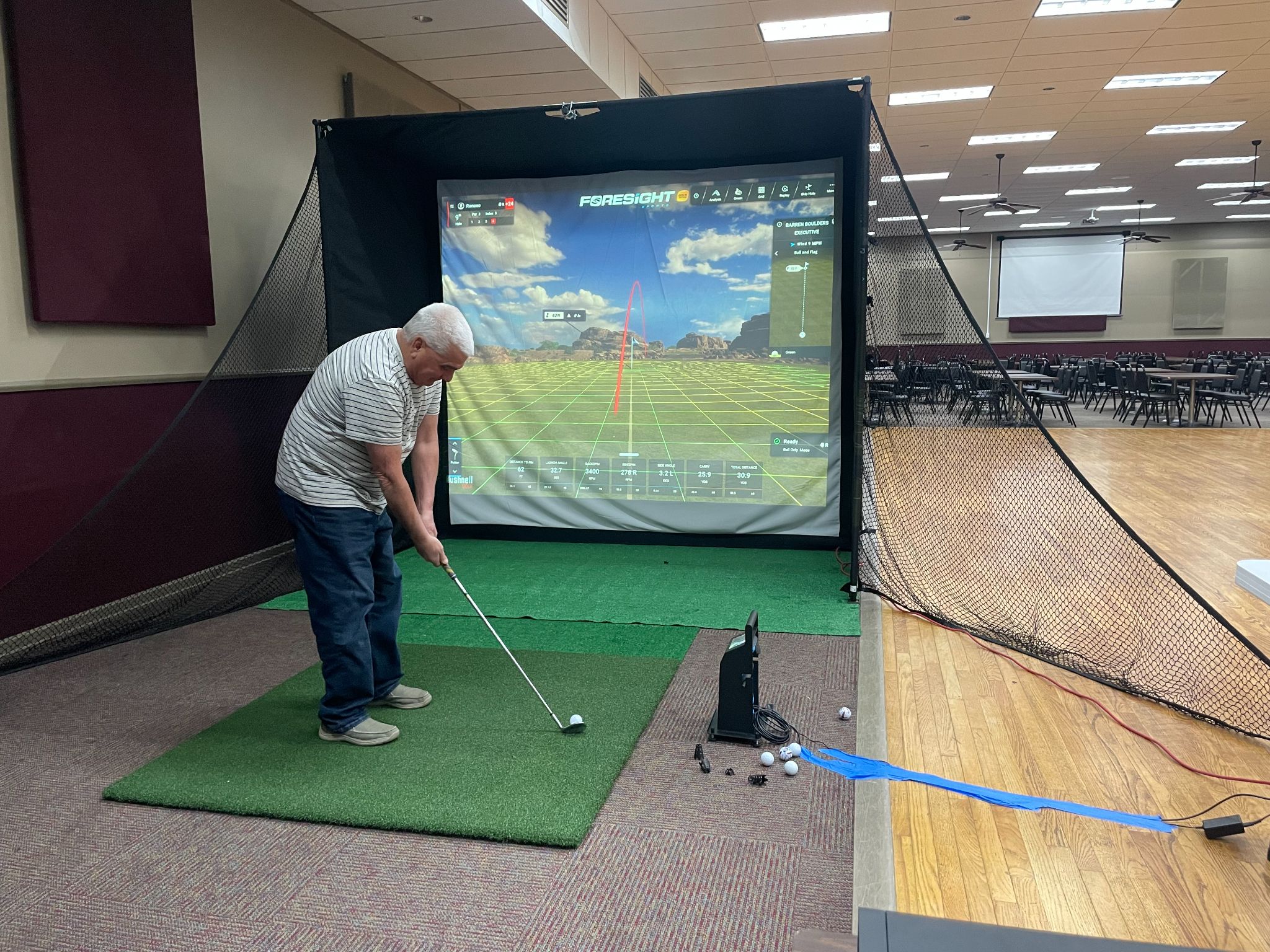 On-Site Golf simulator bay set up inside an event space